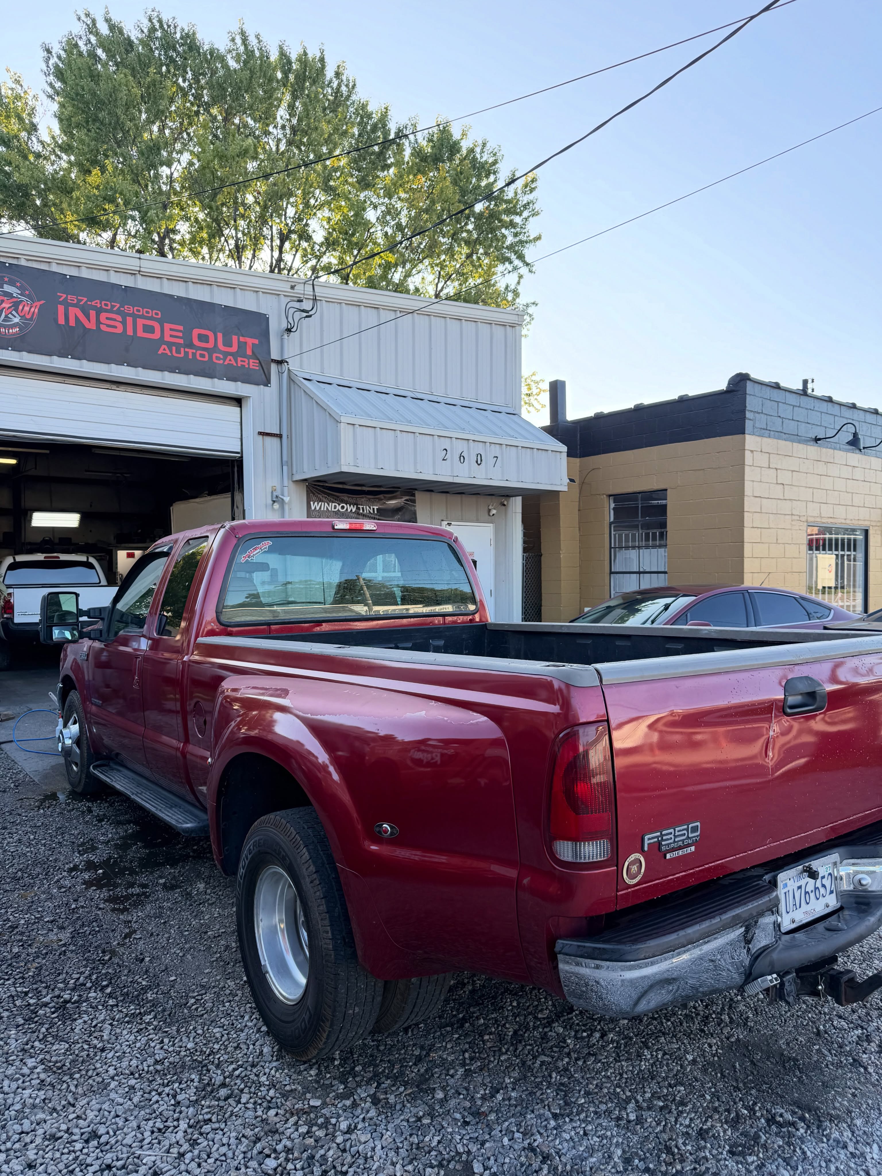 Red Ford pickup outside the Inside Out Auto Care shop at 2607 Wyoming Avenue